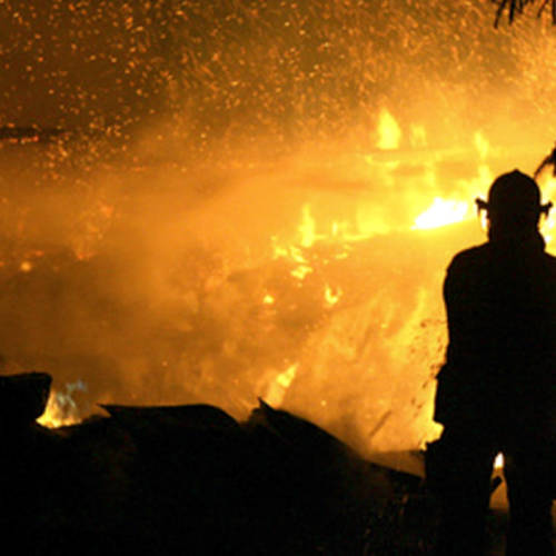 Silhouette of Firefighter and Fire